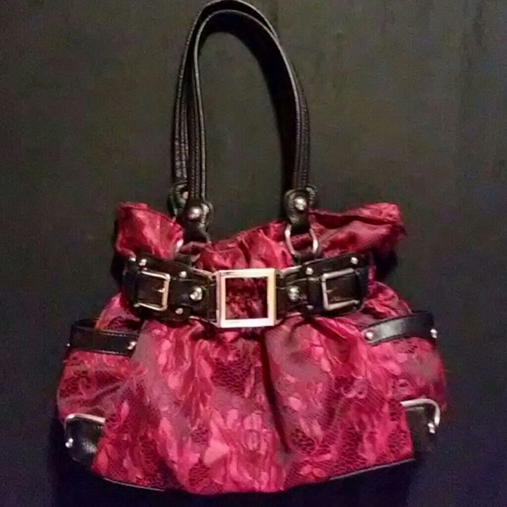 This is a red lacey shoulder bag